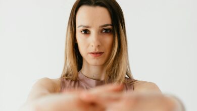 alt="Woman in fitness gear preparing for a 20-minute workout at home"